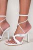 REMI HIGH HEELS WITH KNOTTED STRAP AND LEG TIE IN WHITE FAUX LEATHER